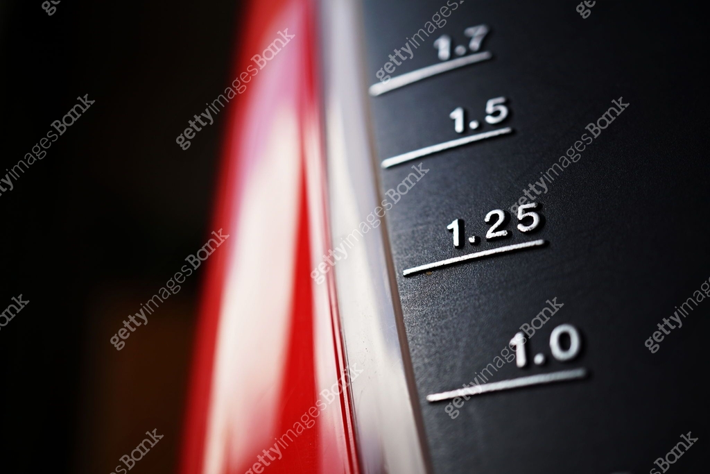 Silver scale measuring volume of liquid (displaying units in liters ...