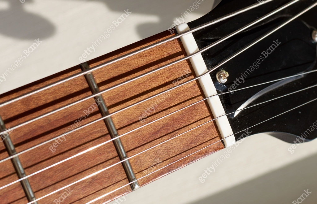 guitar neck and frets. strings shadow on the wood 이미지 (595353588) - 게티이미지뱅크