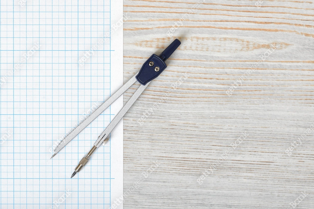 Compas Paper Compass on graph paper in top view with copy space 이미지 (613650982) - 게티 ...