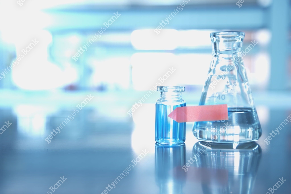 orange label vial and water in flask with science laboratory 이미지 ...