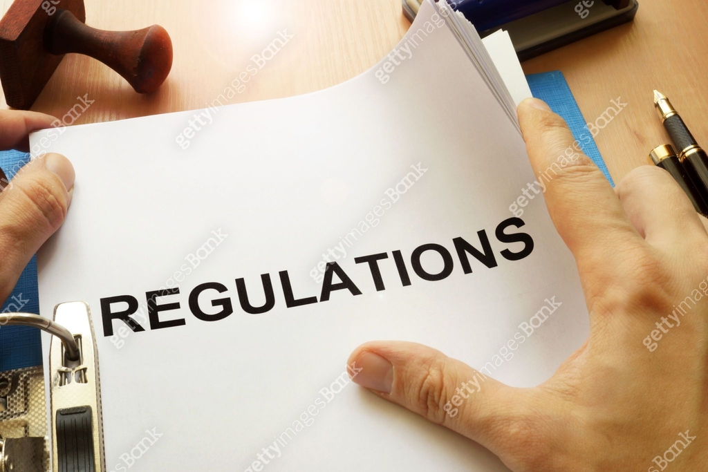 Documents with title Regulations on a table. 이미지 (695596592) - 게티이미지뱅크