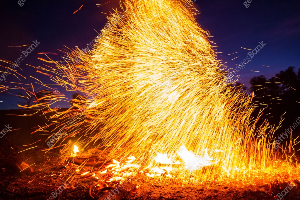 Explodes Out A bright orange column of fire explodes out from a bonfire 이미지 ...