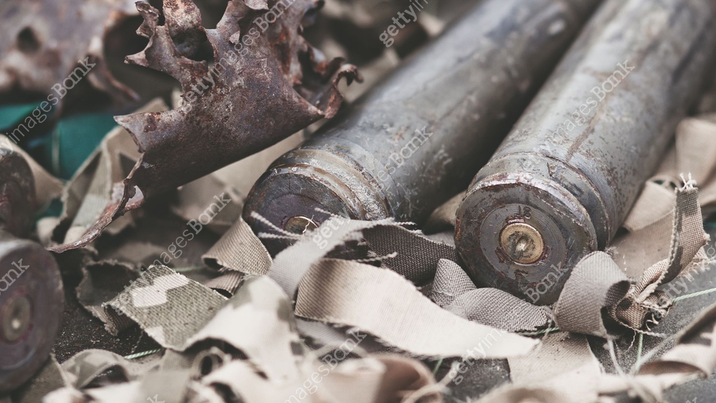 bullet shells from heavy machine gun on the table with camouflage ...