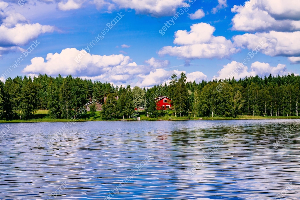 A Traditional Finnish Wooden Cottage With A Sauna And A Barn On The a-traditional-finnish-wooden-cottage-with-a-sauna-and-a-barn-on-the
