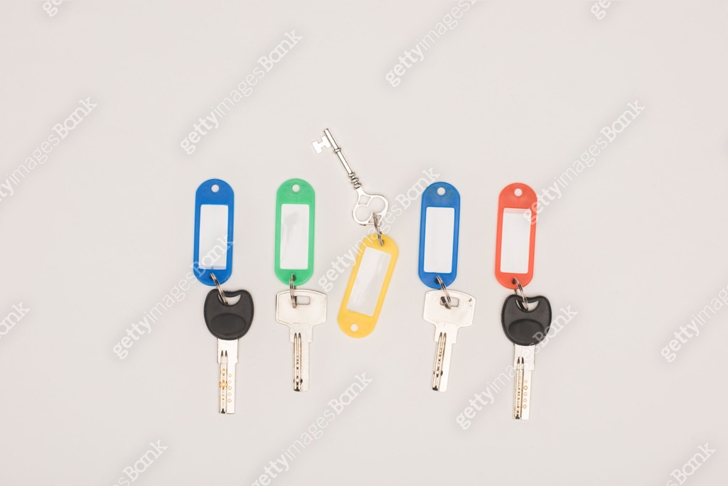 top view set of different keys with colorful labels isolated on white ...