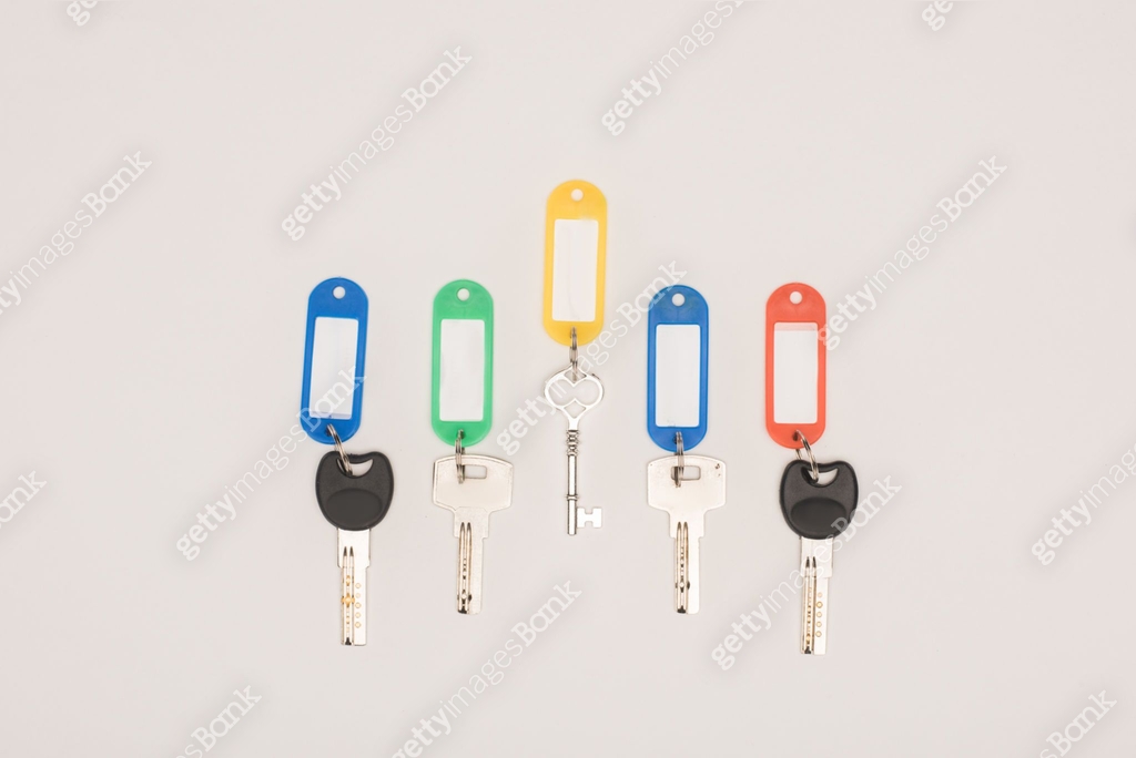 top view of set different keys with colorful labels isolated on white ...