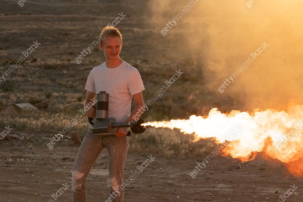 Young Man Operating a Flamethrower 이미지 (973508340) - 게티이미지뱅크