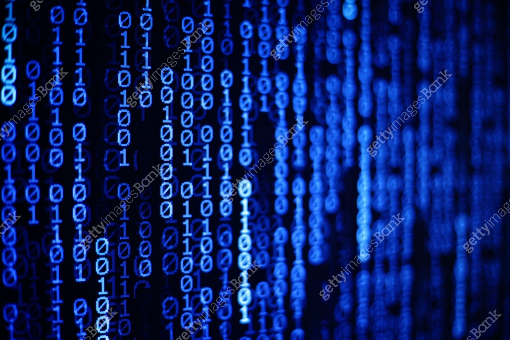 Technology Age. binary code information bit on computer monitor screen ...