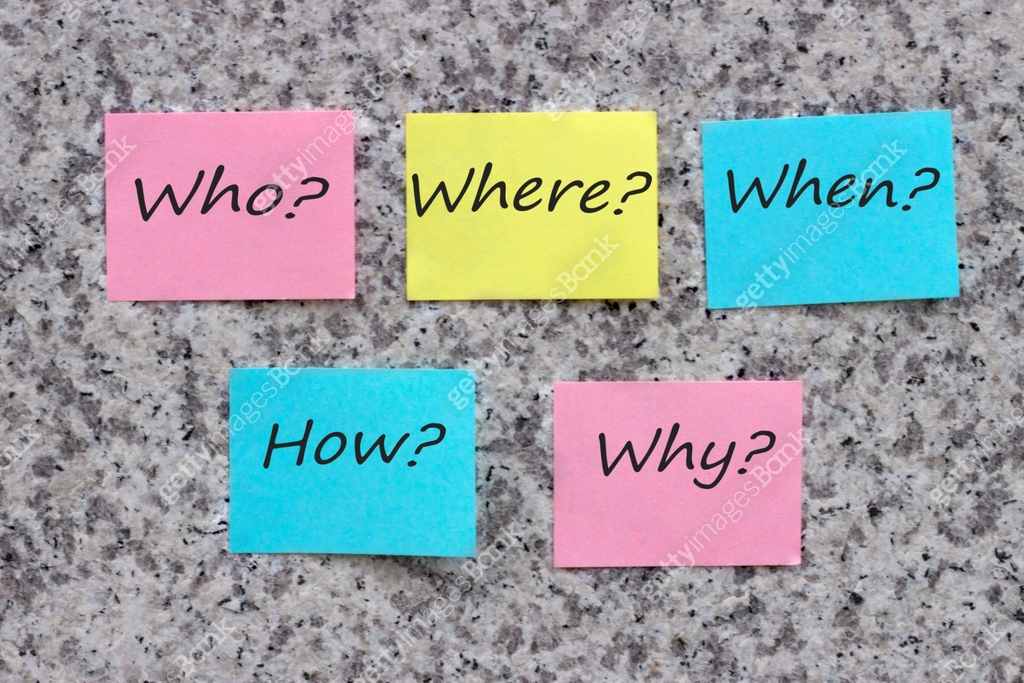 Questions What? Where? When? Why? How? on multi-colored office stickers ...