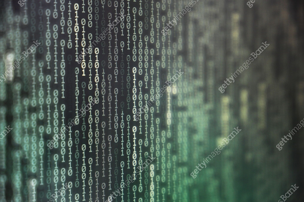 power of big data. binary code information bit on computer monitor ...
