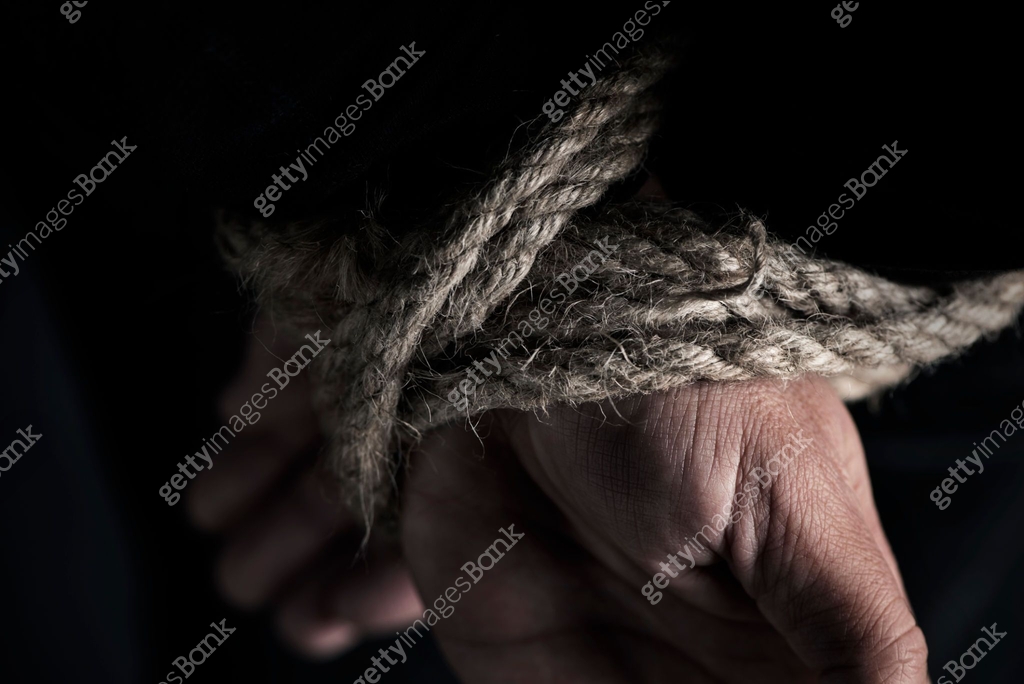 man with his hands tied behind his back 이미지 (1073643878) - 게티이미지뱅크