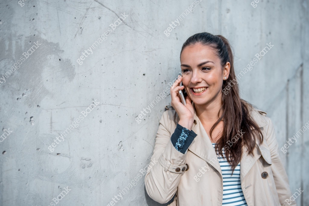 Young woman calling someone over the phone outdoors 이미지 (1062282532 ...