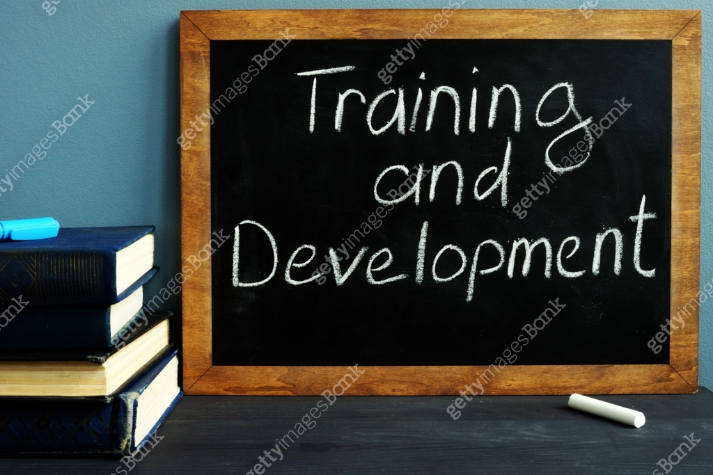Training and development handwritten on a blackboard. 이미지 (1082458164 ...
