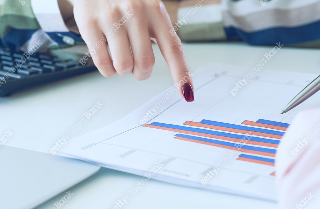 Chart During Two businesswomen discussing financial diagram, graph, business charts ...