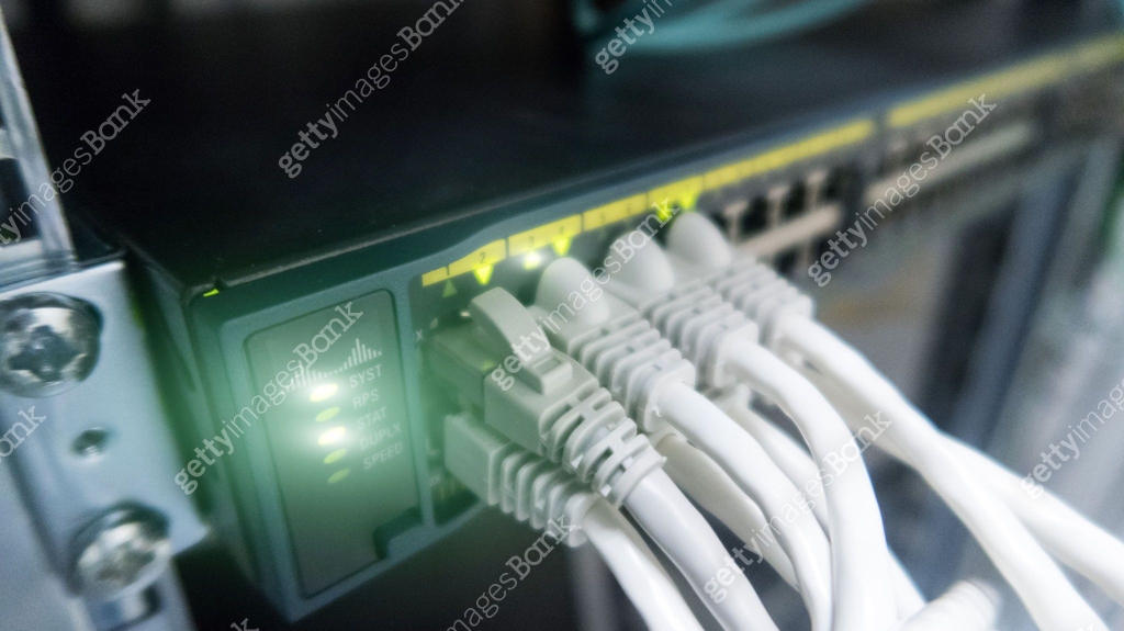 Modern Network panel, switch and lan cable in data center server room ...