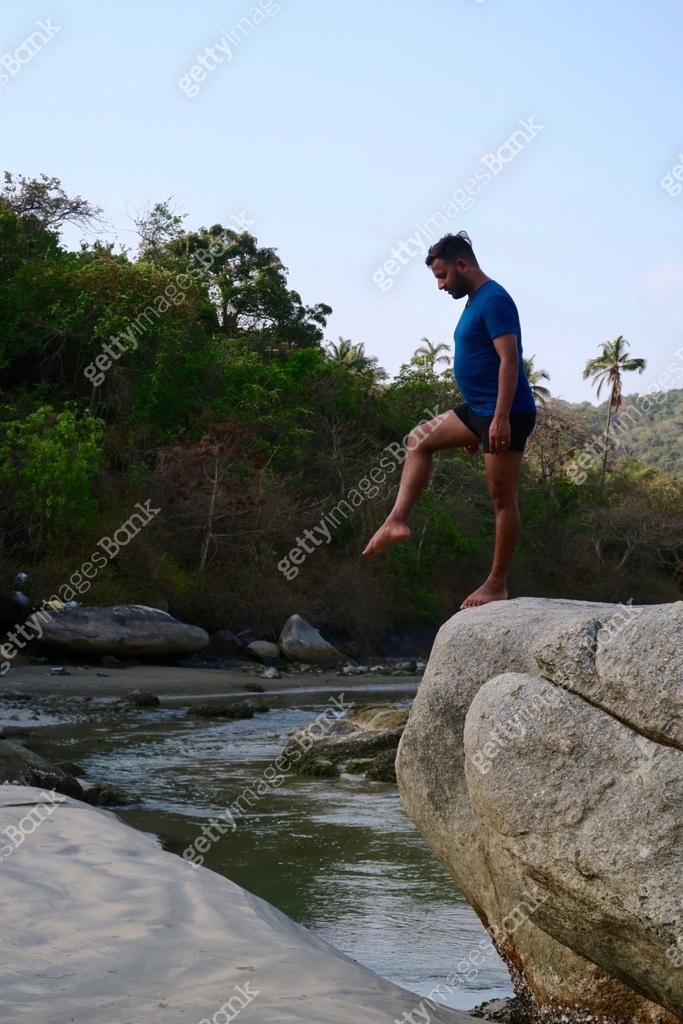 Image of Hindu Indian man practicing Standing Ankle Rotation (Tadasana ...