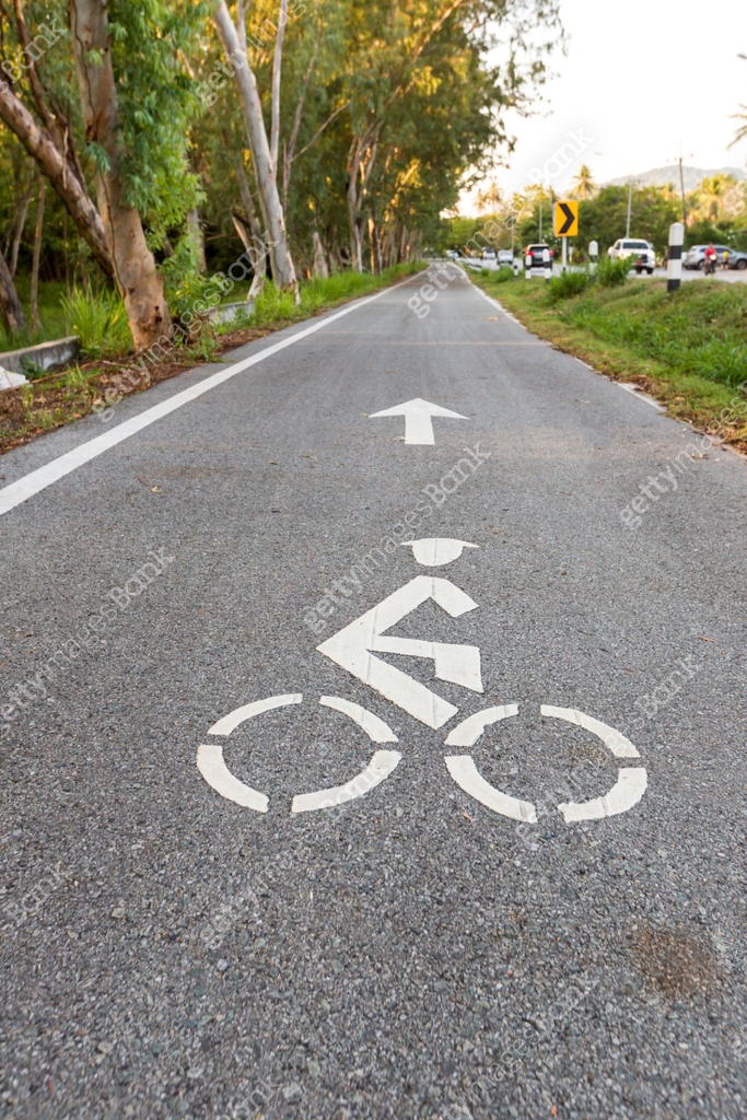 Bicycle road sign and arrow bike lane symbol,bike lane in the garden ...
