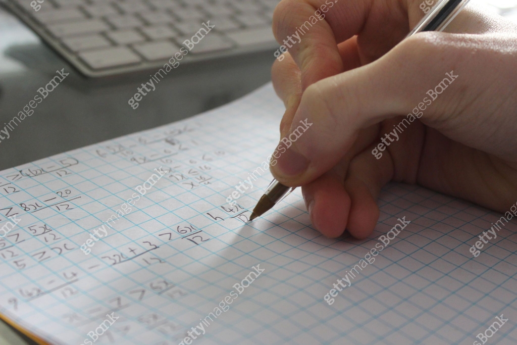 Image of college school boy doing maths homework with biro pen, teenage ...