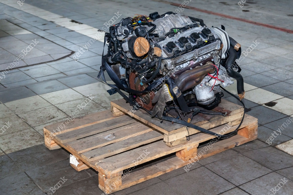 Engine On Pallet Racks Replacement engine used on a pallet mounted for installation on a car ...