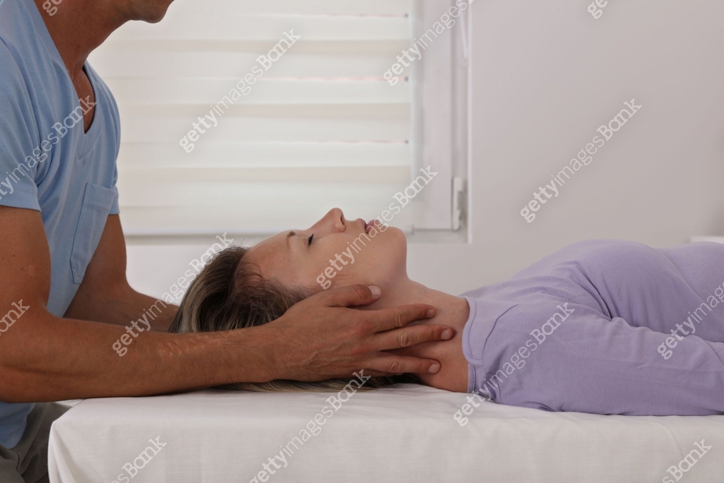 Woman having chiropractic back and neck adjustment. Osteopathy ...