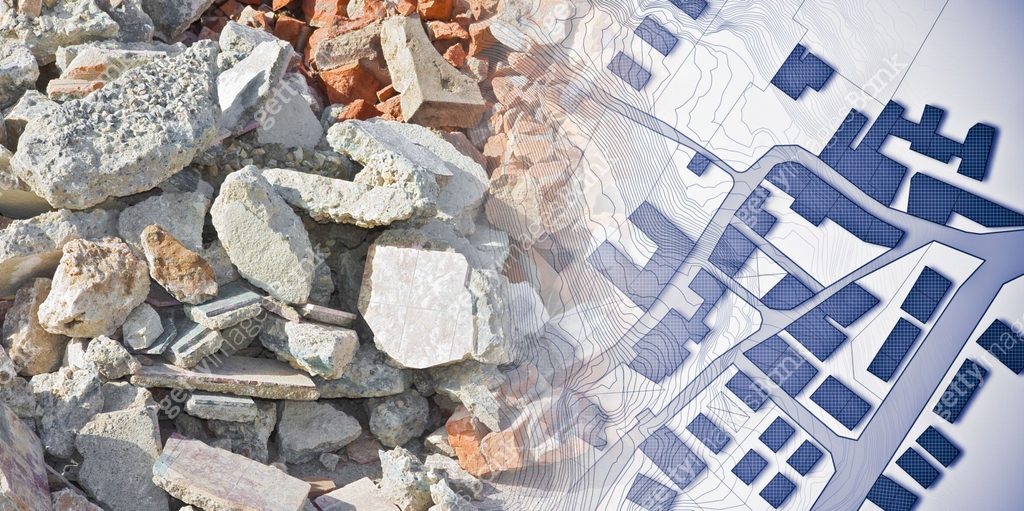 Concrete and brick rubble debris on construction site after a ...