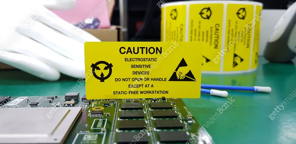 The yellow CAUTION label for Electrostatic Sensitive Devices (ESD) on ...