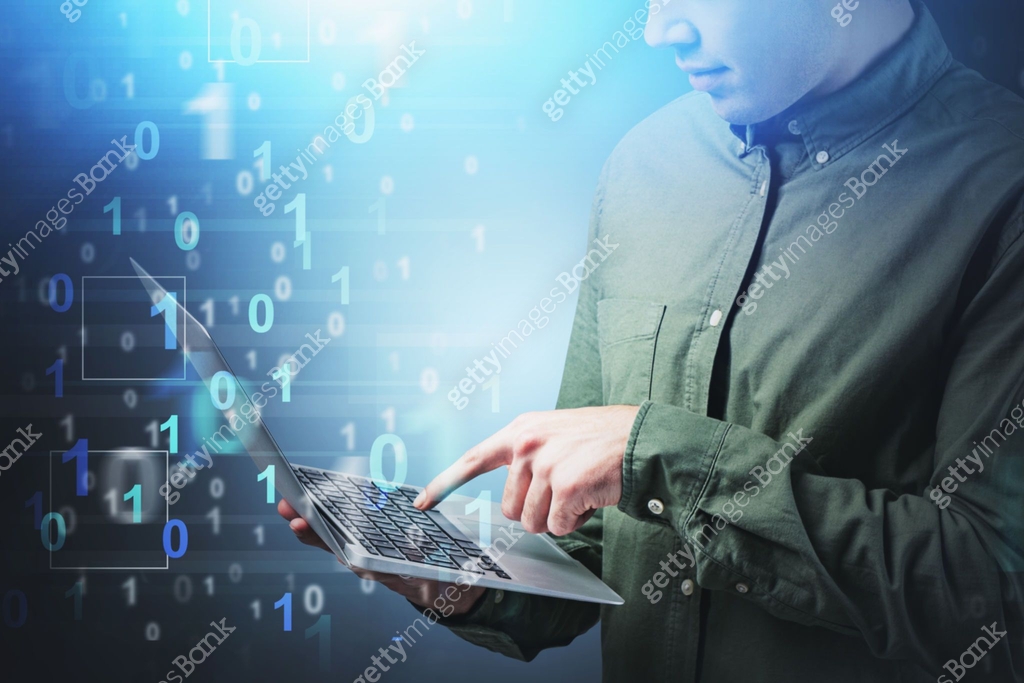 Young man coder with laptop, binary numbers 이미지 (1196690902) - 게티이미지뱅크