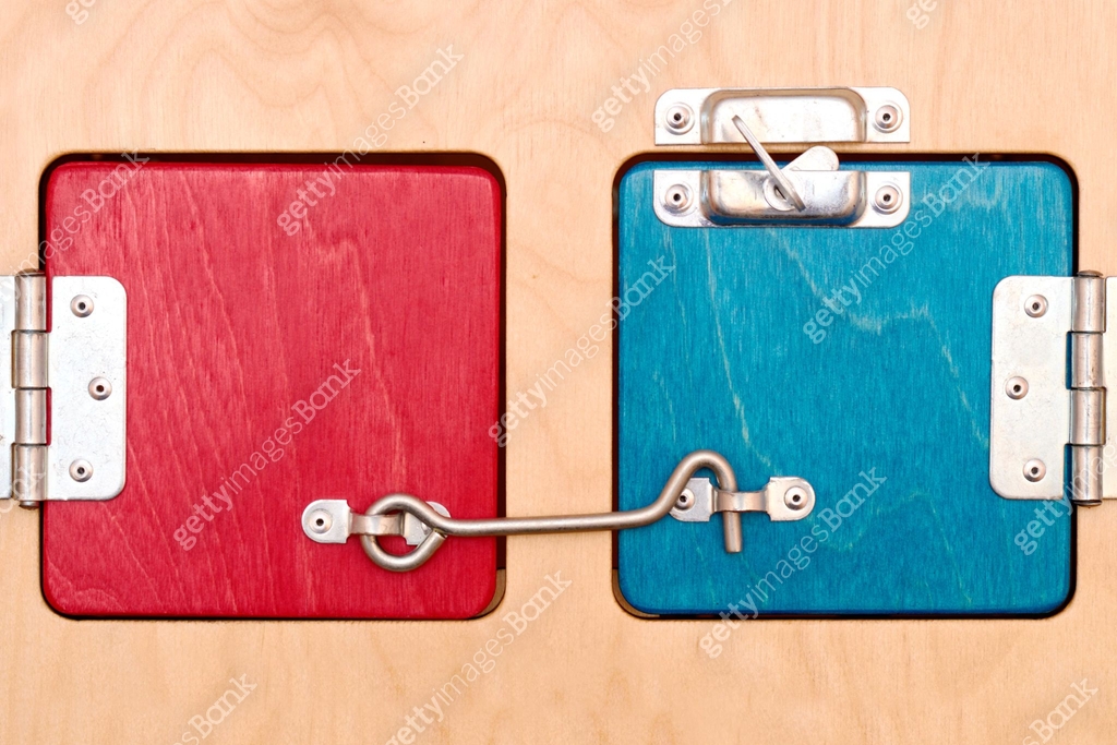 Bright colored wooden windows are covered. Heck, chain and bolt are ...
