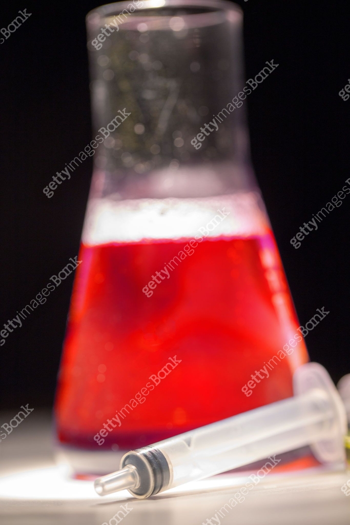 Beaker with red liquid chemical. Chemical experiment with Laboratory ...