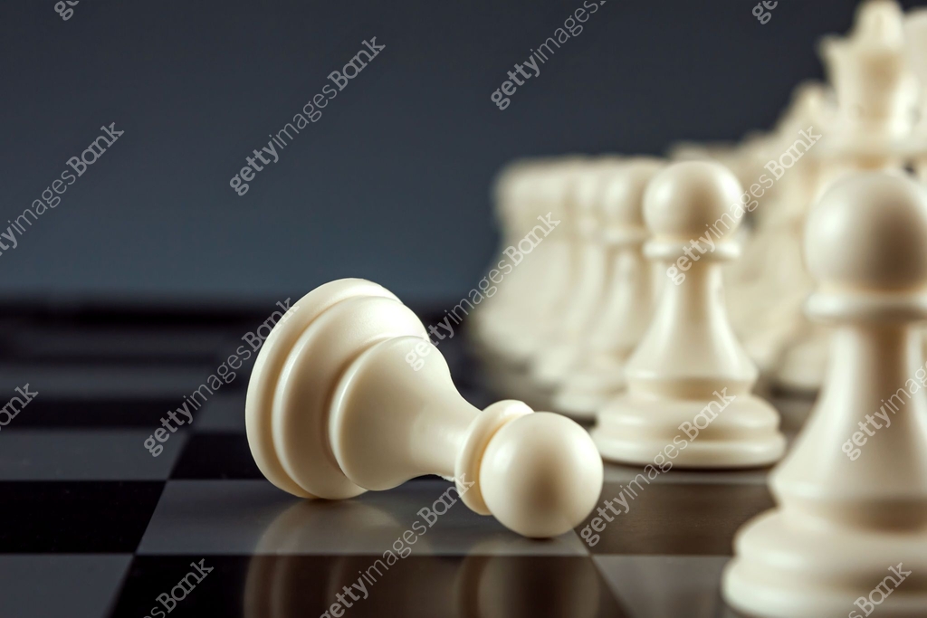 Close-up white pawn lies on a chessboard, chess, game. The concept of ...