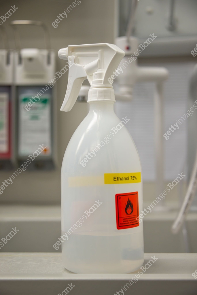 Lab spray bottle with ethanol labeled for disinfection from viruses and ...