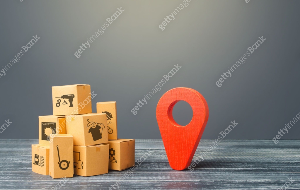 Red location pointer geolocation symbol and cardboard boxes. Global ...