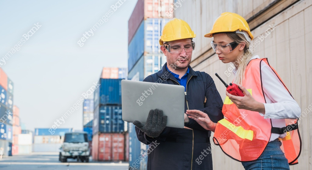 Two foreman man & woman worker working checking at Container cargo ...