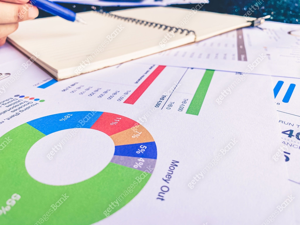 analytics graph and pie chart on many paperwork and statistical ...