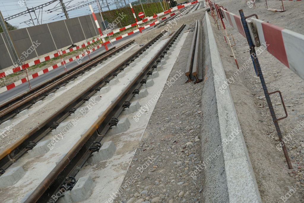 new tram line rails installed in the ground on a concrete base and some ...