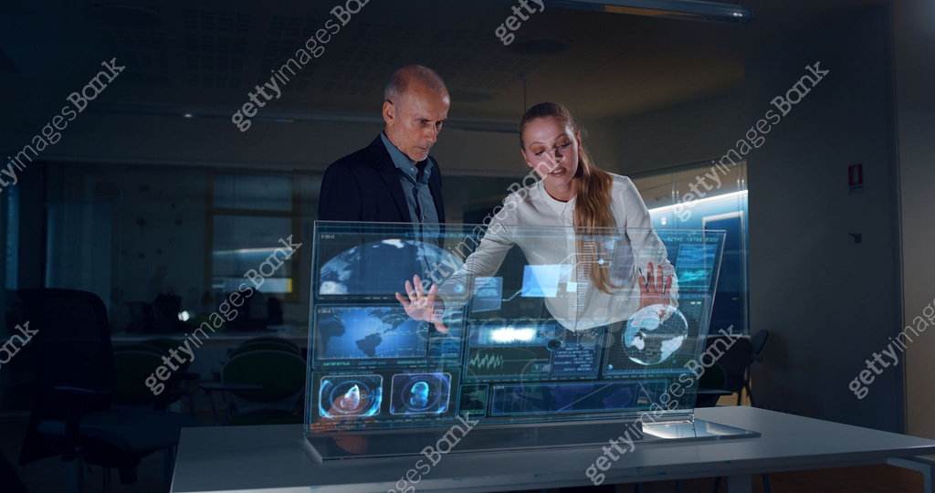 Technology Realisation A group of designer are using a futuristic sophisticated technology ...