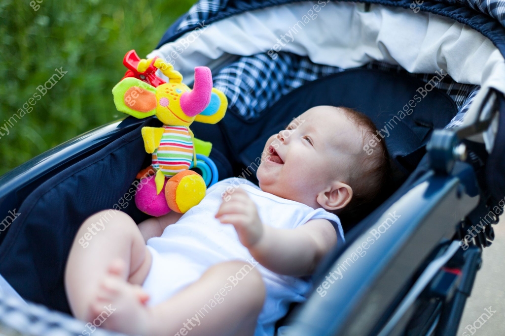 Child In Stroller a small child in a stroller on a walk with mom and dad 이미지 (1240597191 ...