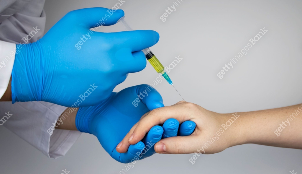 Hand Mpj Injection An orthopedic surgeon gives an injection in the finger joint. Treatment ...