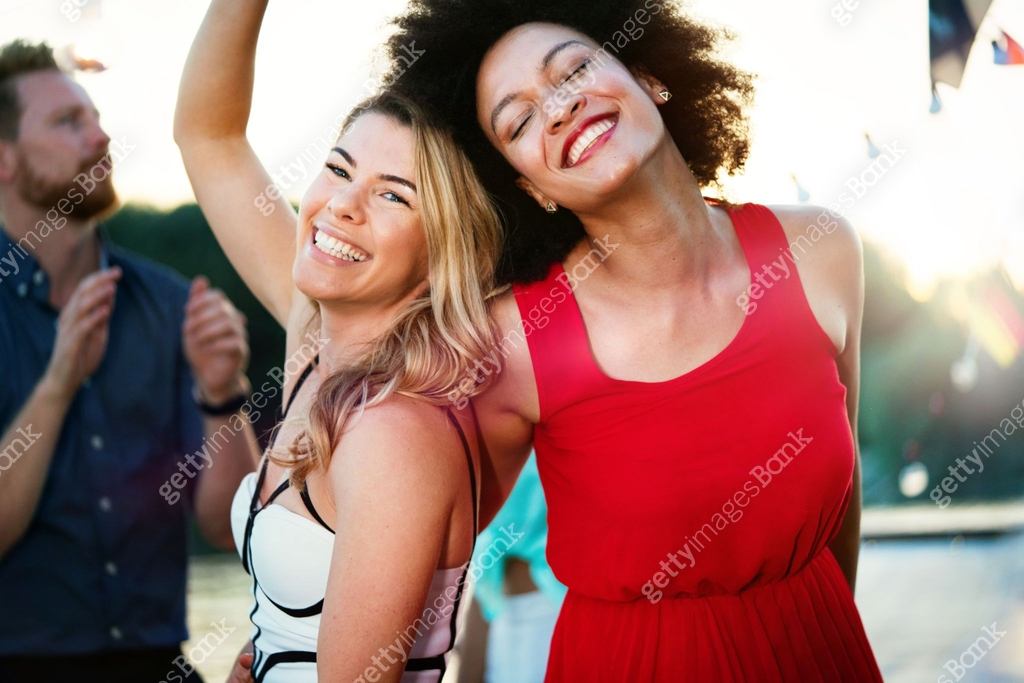 Happy Lesbian Couple Dancing With Champagne At Party Celebration happy-lesbian-couple-dancing-with-champagne-at-party-celebration