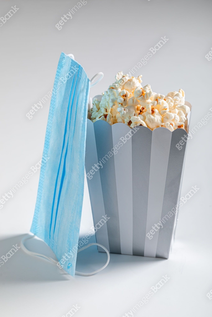 Popcorn Mask Popcorn and blue mask. Pandemic restriction in cinema 이미지 (1287393104 ...