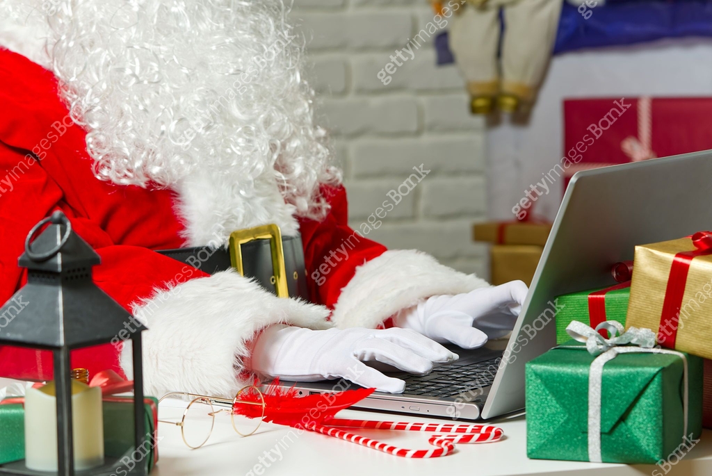 santa sitting behind laptop. Santa Claus in a lockdown sitting behind a ...
