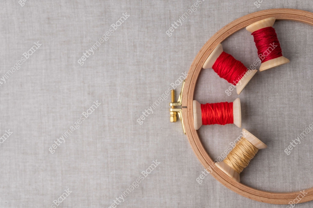 Thread Hoop Color sewing threads with a hoop for the embroidery on light grey ...