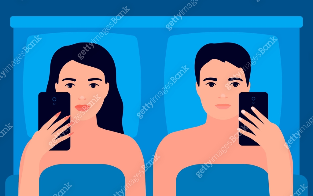 Couple of man and woman lying separate in bed and surfing internet on ...