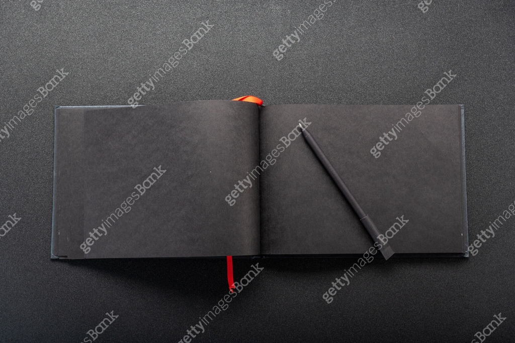 Notebook on the table. Notepad on the table. An expanded journal for ...