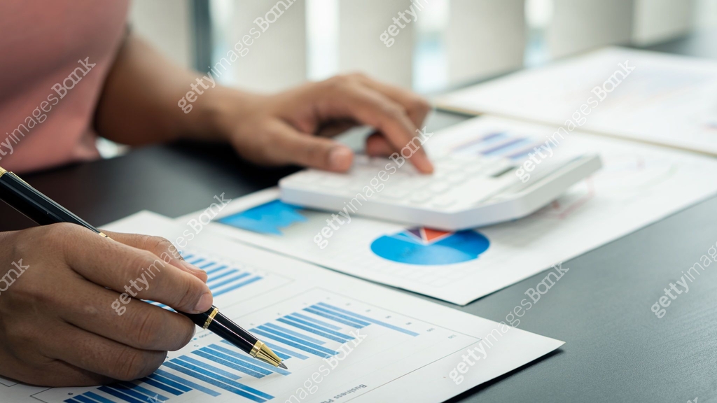 Accountant using computer with clamp and graph document, business man ...