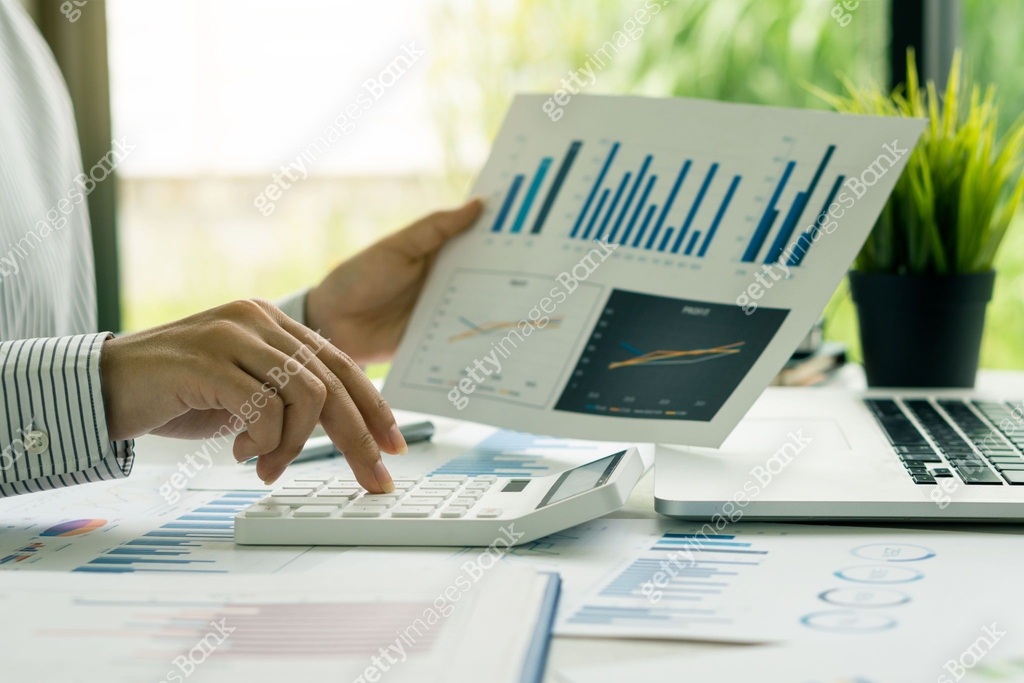 Accountant using computer with clamp and graph document, business man ...
