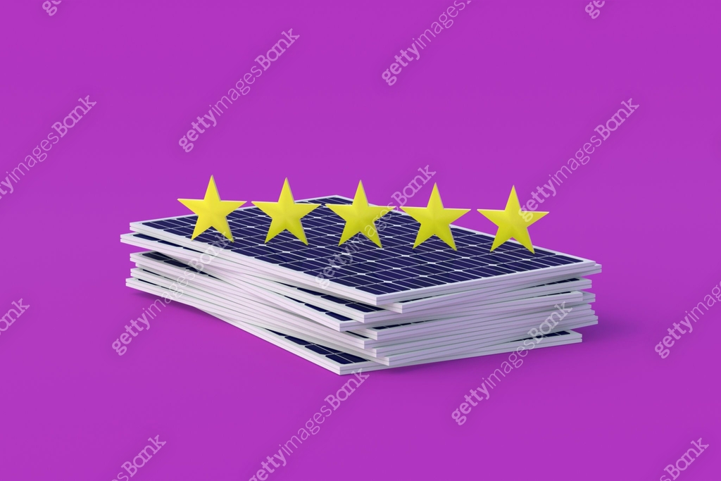 Heap of solar panels near five stars of rating on velvet violet ...