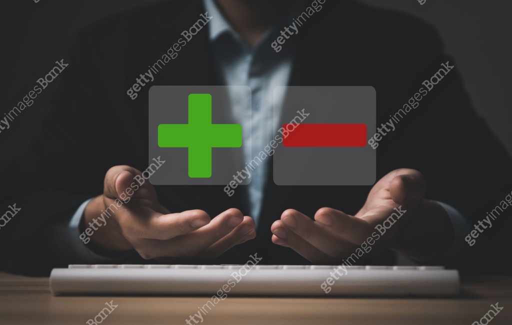 Businessman hand showing plus and minus symbols. The concept of ...