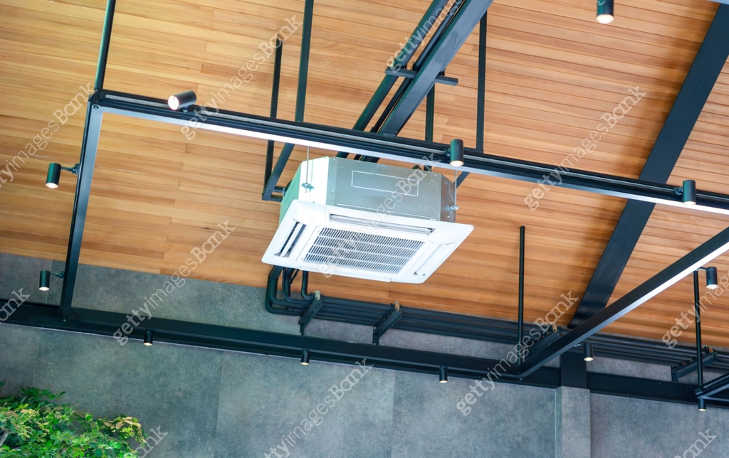 Modern ceiling mounted cassette type air conditioning system in coffee ...