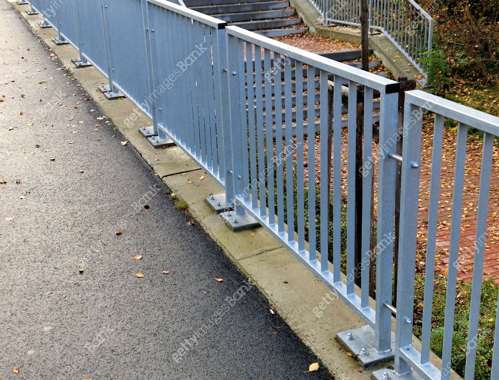 Bridge Railing Attachment bridge railing with vertical fence posts anchored into the ground with ...